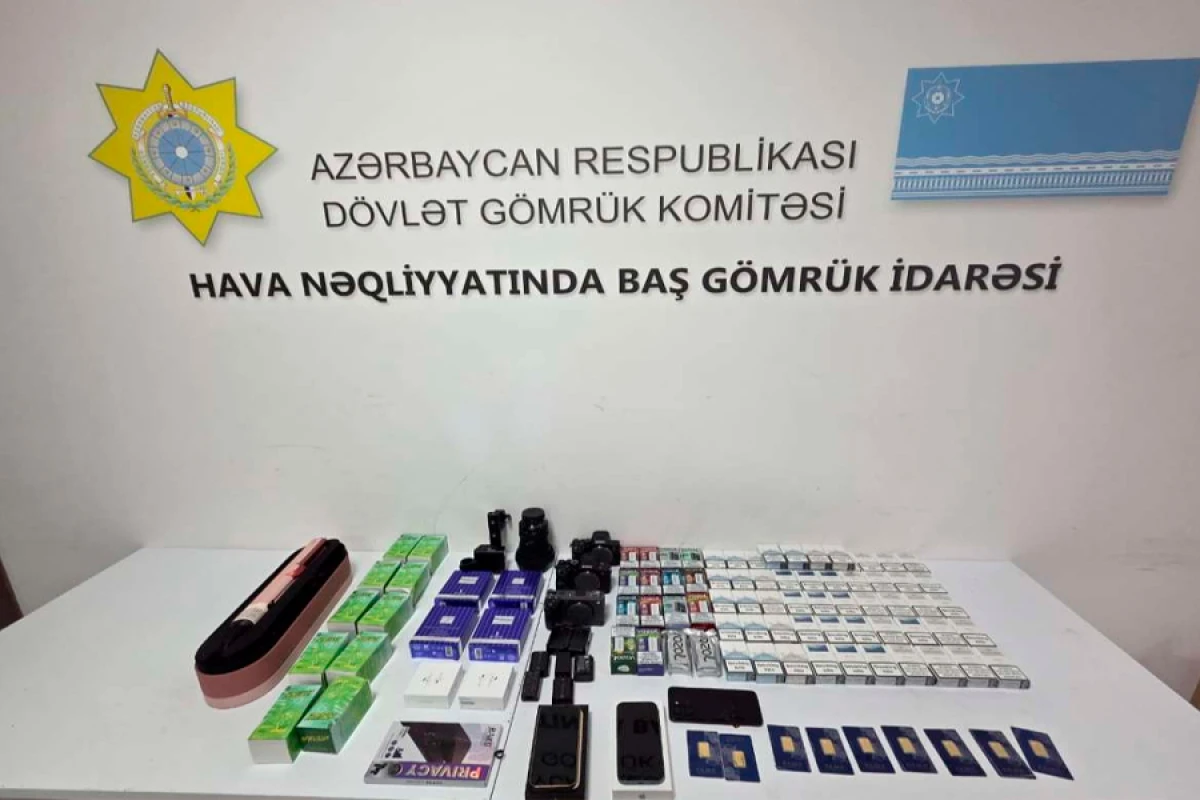 Mobil telefonda gizlədilmiş qızıl külçələr aşkarlandı